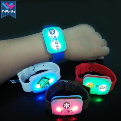 China Custom Festival China LED Wristband Factory Concert Logo Silicone Radio Control LED Wristband Flashing Watch for sale