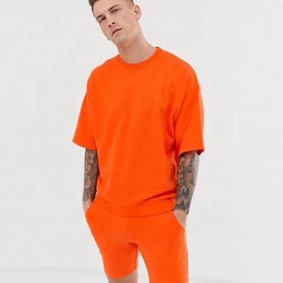 China Viable Fashion Orange Mens Gym Tracksuits Running Men's T-Shirt And Shorts Sets for sale