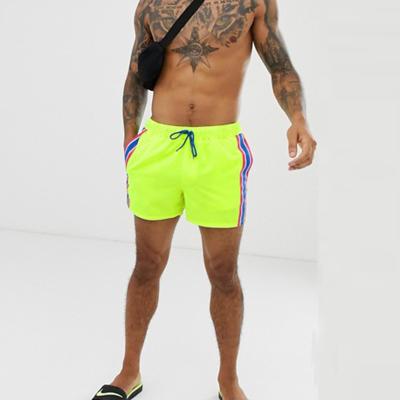 China Anti-wrinkle in short length with side stripe men's swim shorts in neon yellow for sale