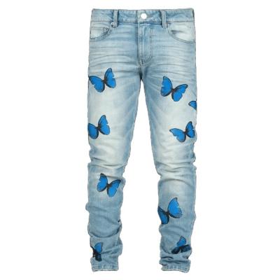 China High fashion breathable streetwear jeans pants butterfly print skinny blue light butterfly stone wash jeans pants for sale