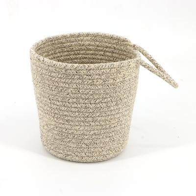 China New Style Small Cotton Rope Handmade Handmade Wall Basket Natural Jute Cotton Rope Plant Basket With Handles for sale