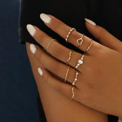 China FASHIONABLE Hot Selling Simple Hollow Like Heart Shaped Ring Geometric Wavy 9 Piece Ring Set for sale