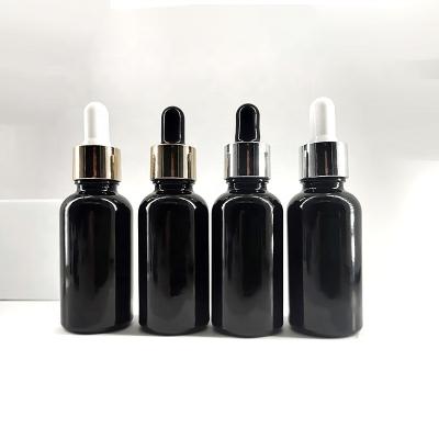 China 10ml 15ml 20ml 30ml 50ml100ml Black Cosmetic Plastic Screw Lid Cosmetic Bottle Vial With Dropper Essential Oil Glass Bottle for sale