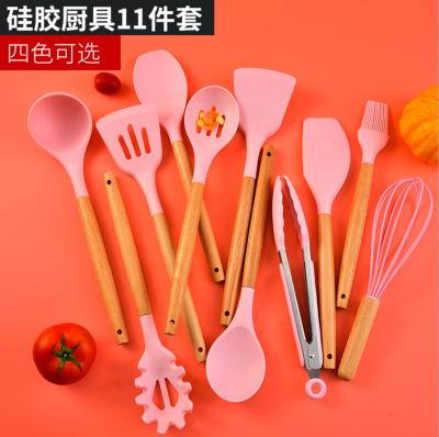 China Sustainable 11 Pieces Pink Color Nonstick Kitchen Tools Implements Beech Wood Handle Kitchen Utensil Set for sale