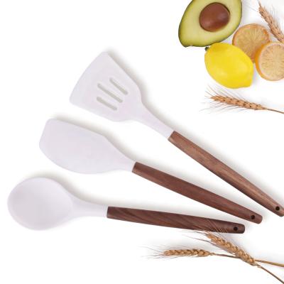 China Sustainable New Trend Universal Silicone Kitchen Tools With Walnut Handle for sale