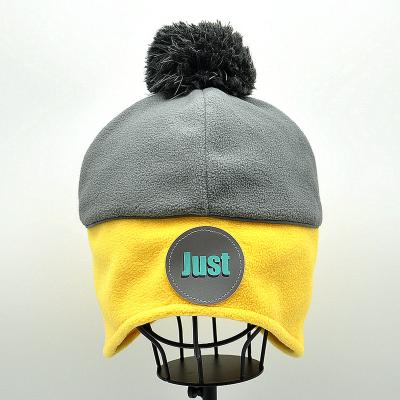 China COMMON Customize promotion Winter beanie hat warm fleece hat with reflective strap for sale