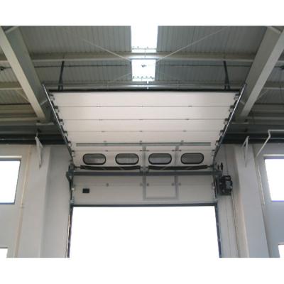 China Windproof Industrial Warehouse Overhead Thermal Insulated Vertical Lifting Sectional Metal Docking Station Garage Roll Up Steel Doors for sale