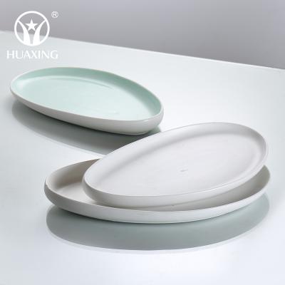 China New Arrival Modern Design Viable Oval Color Glazed Porcelain Hotel Restaurant Ceramic Steak Dishes for sale