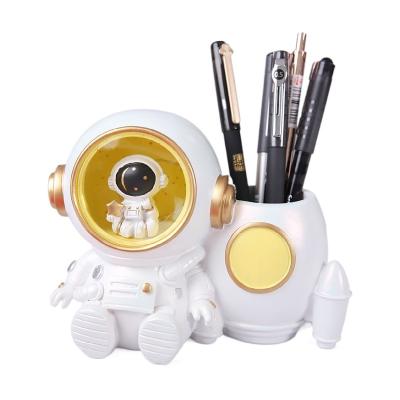 China China Creative Gifts Astronaut With Storage Desk Students Bucket Lamp Desk Pen Hand Resin Wholesale Craft For Home Decoration for sale