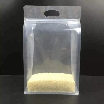 China Moisture Proof Resealable Custom Printing Box Bottom Stand Up Plastic Rice Bag With Hand Hole for sale