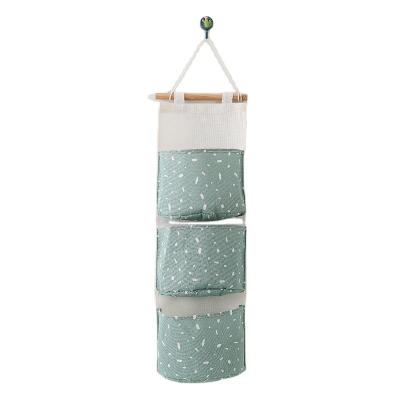 China Viable Type Dot Hanging Bag Rectangle Flat Three Pockets Hanging Bag Storage Organizer For Room for sale