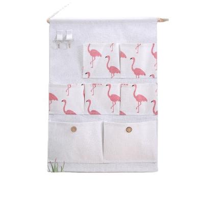 China Home Storage Bag Viable Color Flamingo Hanging Multi Option Fabric Wall Hanging Pouch Organizer Bag for sale