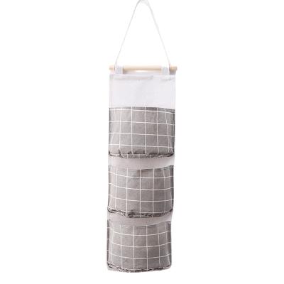 China Durable Household Organizer Closet Storages Bag Foldable Cotton Grid Dustproof Hanging Canvas Pockets Hanging Bag for sale