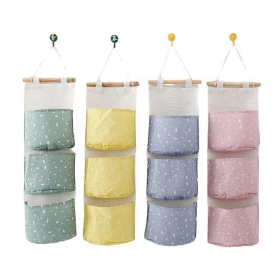 China Viable Type Dot Hanging Bag Rectangle Flat Three Pockets Hanging Bag Storage Organizer For Room for sale