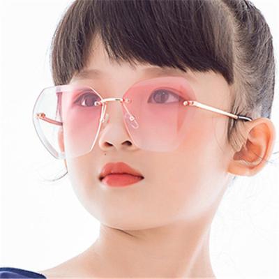 China Fashion sunglasses wholesale fashion kids shade kids gift pink kids irregular rimless sunglasses uv400 for sale