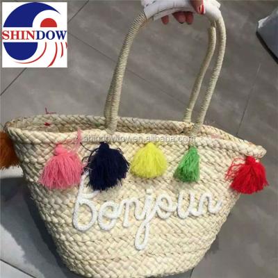 China Environmental Friendly Colorful Pom Pom Straw Beach Bag With Customized Logo for sale