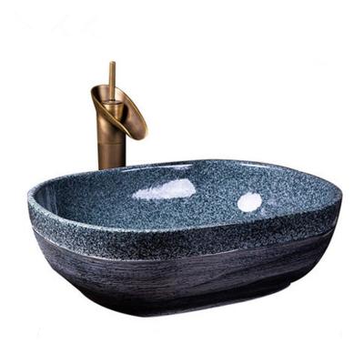 China Chinese high quality hand fired 1300 degree carved ceramic stone design dark blue color bathroom sink for restaurant for sale