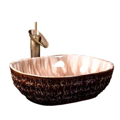 China Wonderful Chinese Design 1300 Degree Fired Hand Carved Modern Color Glazed Artistic Ceramic Oval Hand Wash Basin for sale