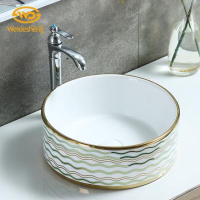 China Hand Wash Design Round Plate Wave Pattern Art Table Top Porcelain Basin Bathroom Wash Sink Colored Ceramic Sink for sale