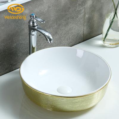 China Hand Wash Countertop Wide Gold Glass Simple Round Hole Art Mirror Hand Use Ceramic Sink for sale