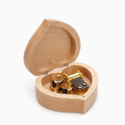 China Custom Logo Heart Shape Maple Walnut Wood Material Wooden Music Box For Gifts for sale