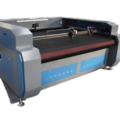 China Laser CUTTING Auto Feeding CO2 Laser Cutting Machine For Surgical Gown Auto Feeding for sale