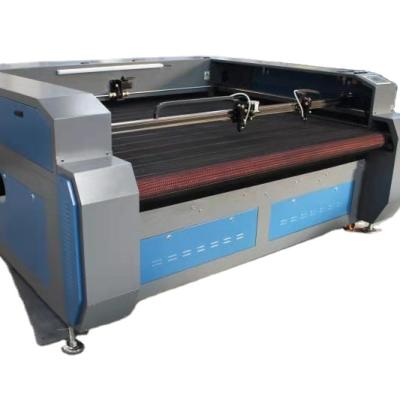 China Laser CUTTING Garment Garment Fabric CO2 Laser Cutting Machines For Making Clothes for sale