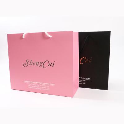 China ShengCai Handmade Hot Selling Logo Printed Silver Hot Stamping Luxury Custom Packaging Shopping Bags For Clothes for sale