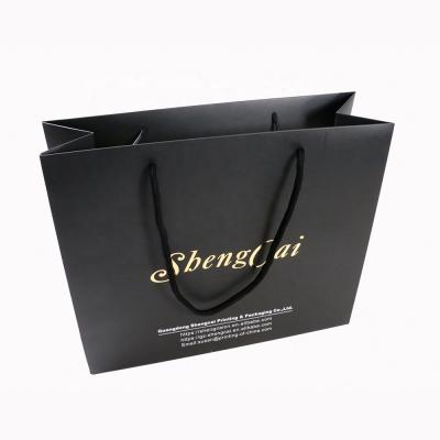 China Recyclable Luxury Custom Logo Gold Foil Black Paper Bag Wigs Packaging Gift Bags for sale