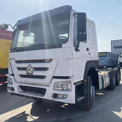 China Brand new RHD double sleeper 6X4 HOWO tractor truck 371HP with 1600L extra fuel tank for sale 6.8*2.5*3.1 for sale