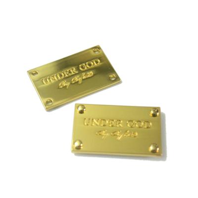 China Nickel Free Custom Gold Plated Metal Tags With Brand Logo For Apparel for sale