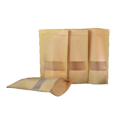 China Microwaveable Self-supporting self-sealing kraft paper bag frosted window food dried fruit tea packaging bag for sale