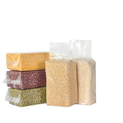 China Microwaveable Transparent Thickened Whole Grains Nylon Plastic Rice Brick Bag Wholesale Millet Rice Packaging Bag for sale