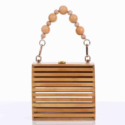 China Other Summer Hot Sale Semicircle Hollow Out Clutch Purse Handbags Straw Bag For Women Bamboo Beach Bag for sale