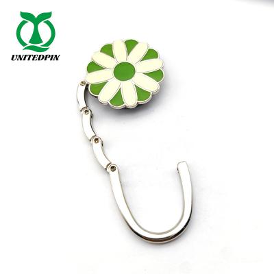 China Custom Beautiful Metal Grass Shape Bag Hanger White Coloufull White Hook Bag Hanger Purse Hangers for sale