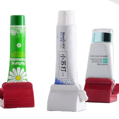 China Sustainable Wholesale Travel Plastic Rolling Tube Toothpaste Squeezer Bathroom Set Accessories Can Customize Logo for sale