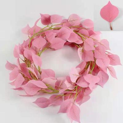 China 2021 Durable Hanging Artificial Rattan Tree Hanging Wreath Leaves For Christmas Decoration for sale