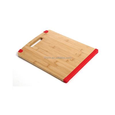 China Large Sustainable Anti Slip Wooden Bamboo Cutting Board With Silicone Edges for sale