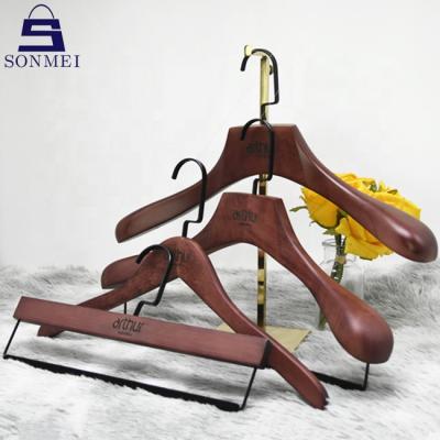 China Durable Luxury OEM Boutique Custom Beech Wood Mahogany Hangers For Clothes for sale