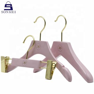 China Durable High End Custom Pink Wooden Kids Hanger Child Clothes Baby Hangers for sale