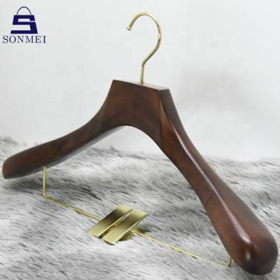 China Durable Golden Sling Brown Wood Hangers Accommodate Wooden Skirt Hangers With Clips for sale