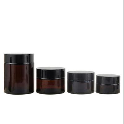 China 20g 30g 50g 100g Custom Empty Cosmetic Amber Cream Jar With Black Lid for sale