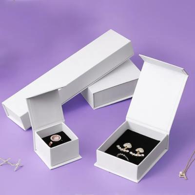 China Recycled Materials Jewelry Magnetic Giftbox Printed Book Shaped White Cases Ring Earring Magnet Storage Hand Decoration Gift Box for sale