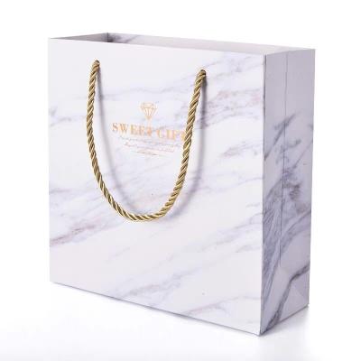 China Marble creative large handbag small cool wind recyclable INS store clothing paper bag thickening gift bag marble shopping bag for sale