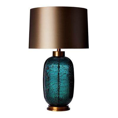 China Luxury Modern American Style Emerald Green Glass Lamp Metal Hotel LED Table Light for sale