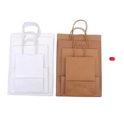 China Recycled Materials Personalized Logo Bag En Tote Kraft Paper Carrier Clothes Packaging Bags Custom Gift Shopping Paper Bags For Boutique for sale