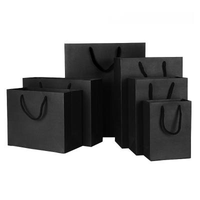 China Recyclable Manufacturers produce luxury black cardboard paper bags Gift Bags with Handles for sale