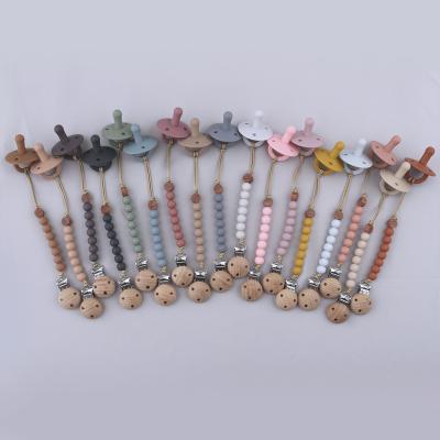 China Christmas Rust Free Silicone Baby Pacifier Clip Chain Gum Massager Designs Stylish Baby Toys for sale