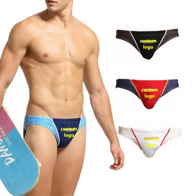 China Fashion breathable trend a variety of color collocation beach briefs men's youth beach swimming trunks waterproof sexy bikini bottom for sale