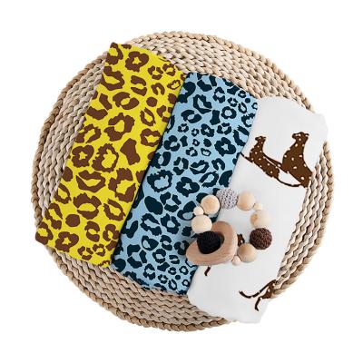 China PORTABLE hot sale leopard grain design high quality organic bamboo newborn baby muslin blankets soft swaddle 100% cotton swaddle for sale